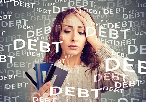 Woman swimming in credit card debt